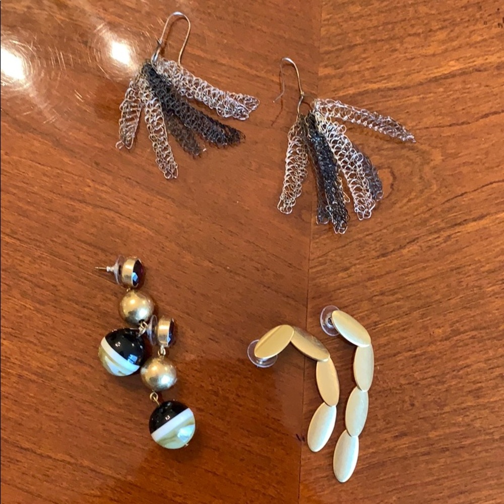 Assortment of four earrings.